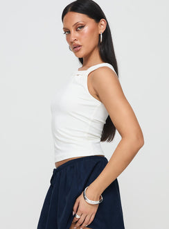 side view of model wearing Princess Polly Corcus Top White Sleeveless Asymmetric Neckline 