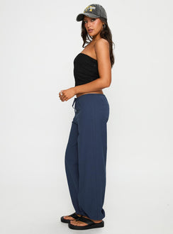 side view of model wearing Princess Polly Zodie Low Waist Pants Navy Low Rise Pants 