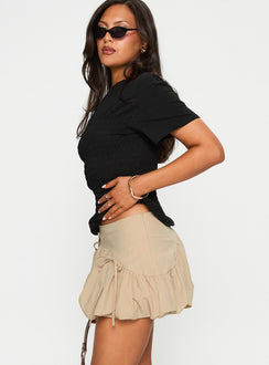   side view of model wearing Princess Polly Palloma Bubble Hem Mini Skirt Beige Mini Skirts 