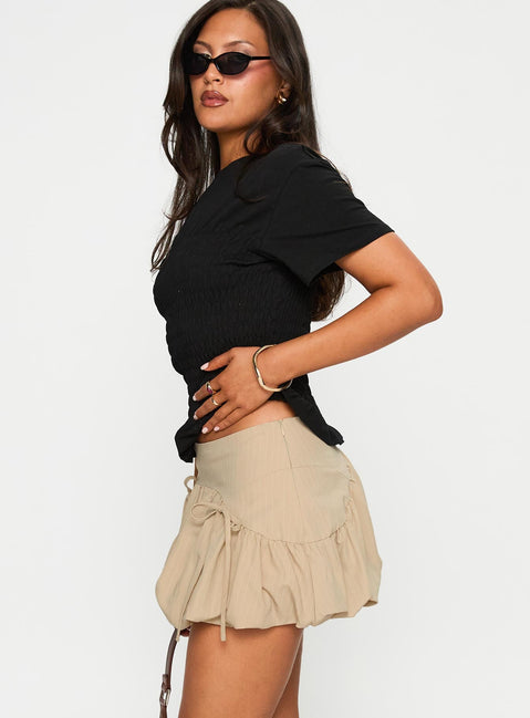   side view of model wearing Princess Polly Palloma Bubble Hem Mini Skirt Beige Mini Skirts 