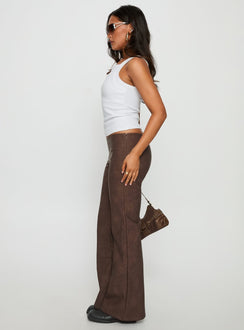 side view of model wearing Princess Polly Trickrider Tie Side Faux Leather Pants Chocolate Mid Rise Pants 