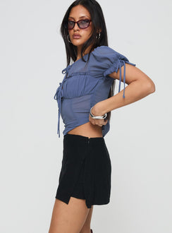 side view of model wearing Princess Polly Adios Linen Blend Skort Black High Waisted Shorts 