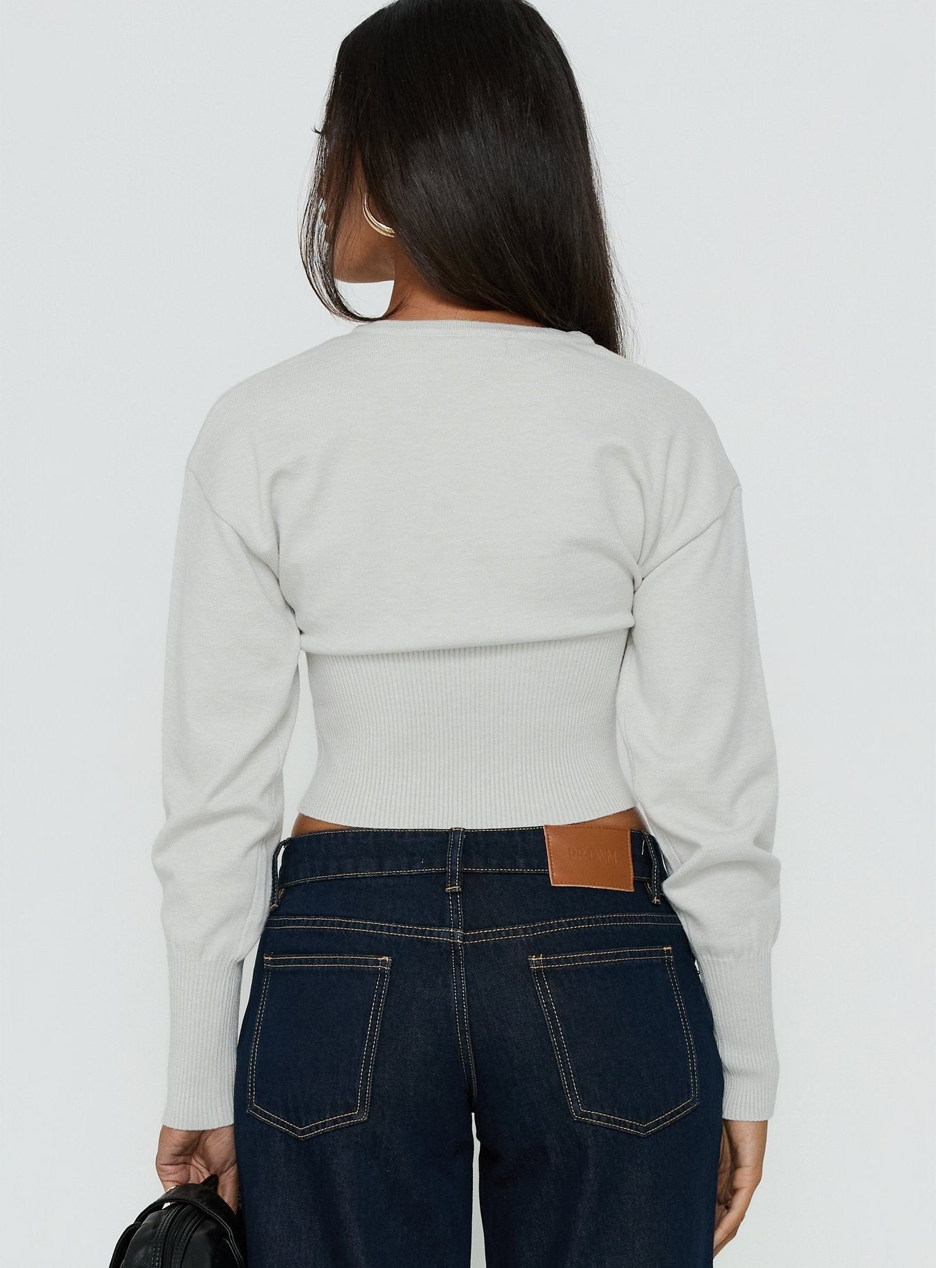 Crafted to showcase the Emerina Cinched Button Down Cardigan Grey womens jumpers with short length back view of model wearing Princess Polly