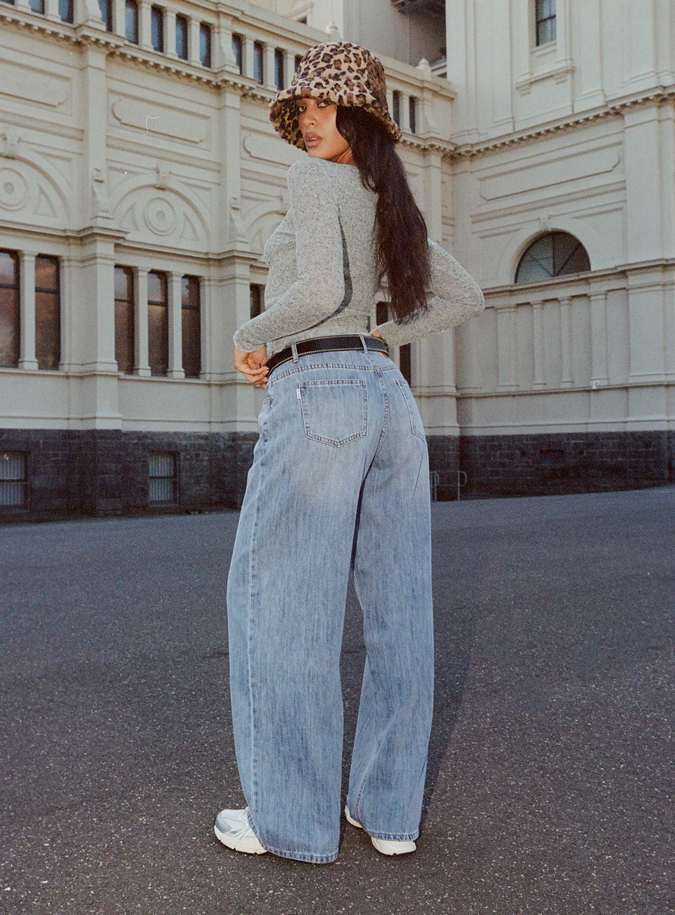 back view of model wearing Princess Polly Moonshine Wide Leg Jeans Mid Wash Mid Rise 