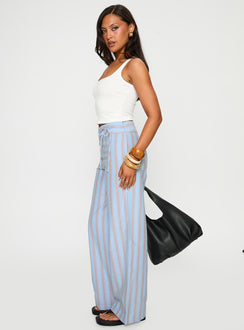 side view of model wearing Princess Polly Rush Hours Pants Blue Multi High Waisted Pants 