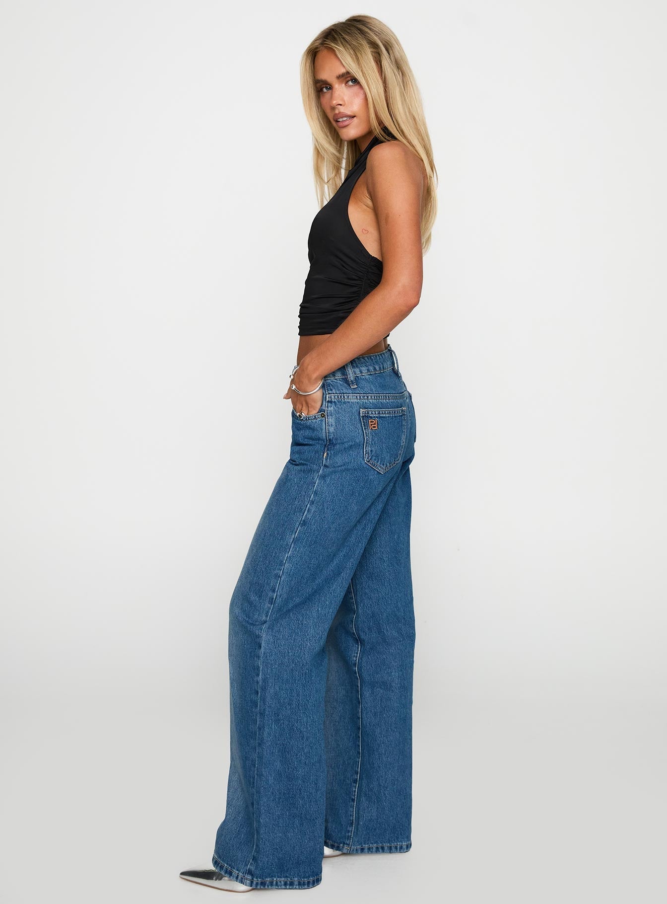 side view of model wearing Princess Polly On Sunset Mid Rise Straight Leg Jeans Dark Wash Mid Rise 