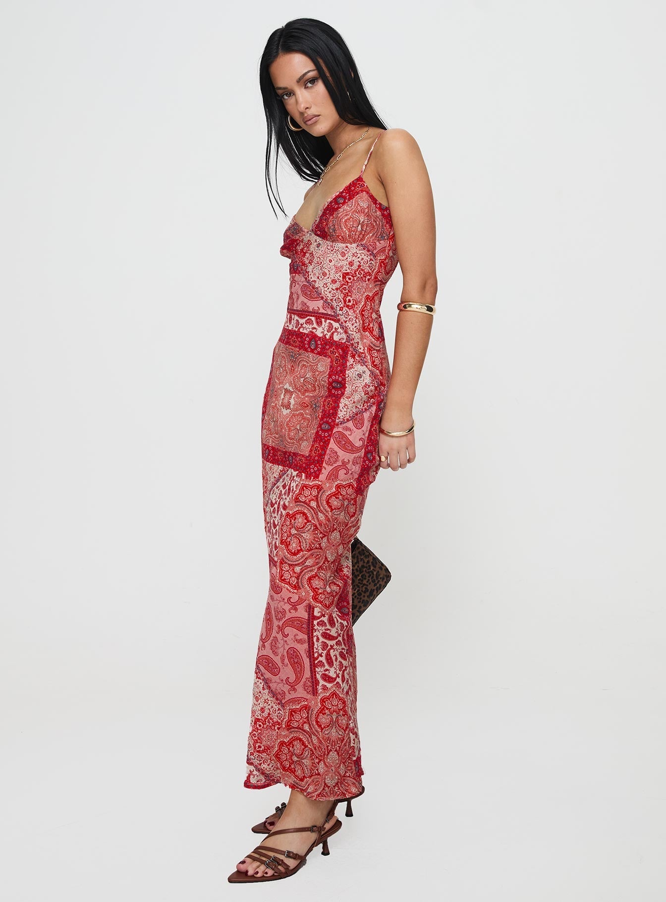 side view of model wearing Princess Polly Sugar Plum Maxi Dress Red Paisley V-Neck 