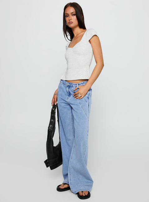 side view of model wearing Princess Polly Reaper Baggy Denim Jeans Light Blue Wash Mid Rise 