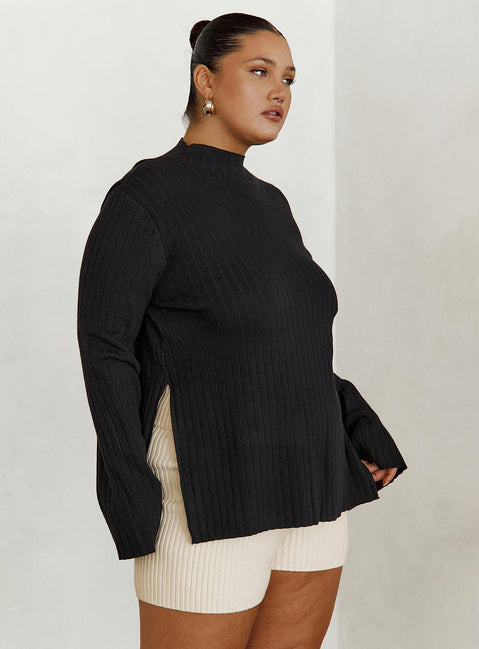Sweater Relaxed fit, ribbed material, mock neckline, splits at side hem, flared cuff Good stretch, Unlined