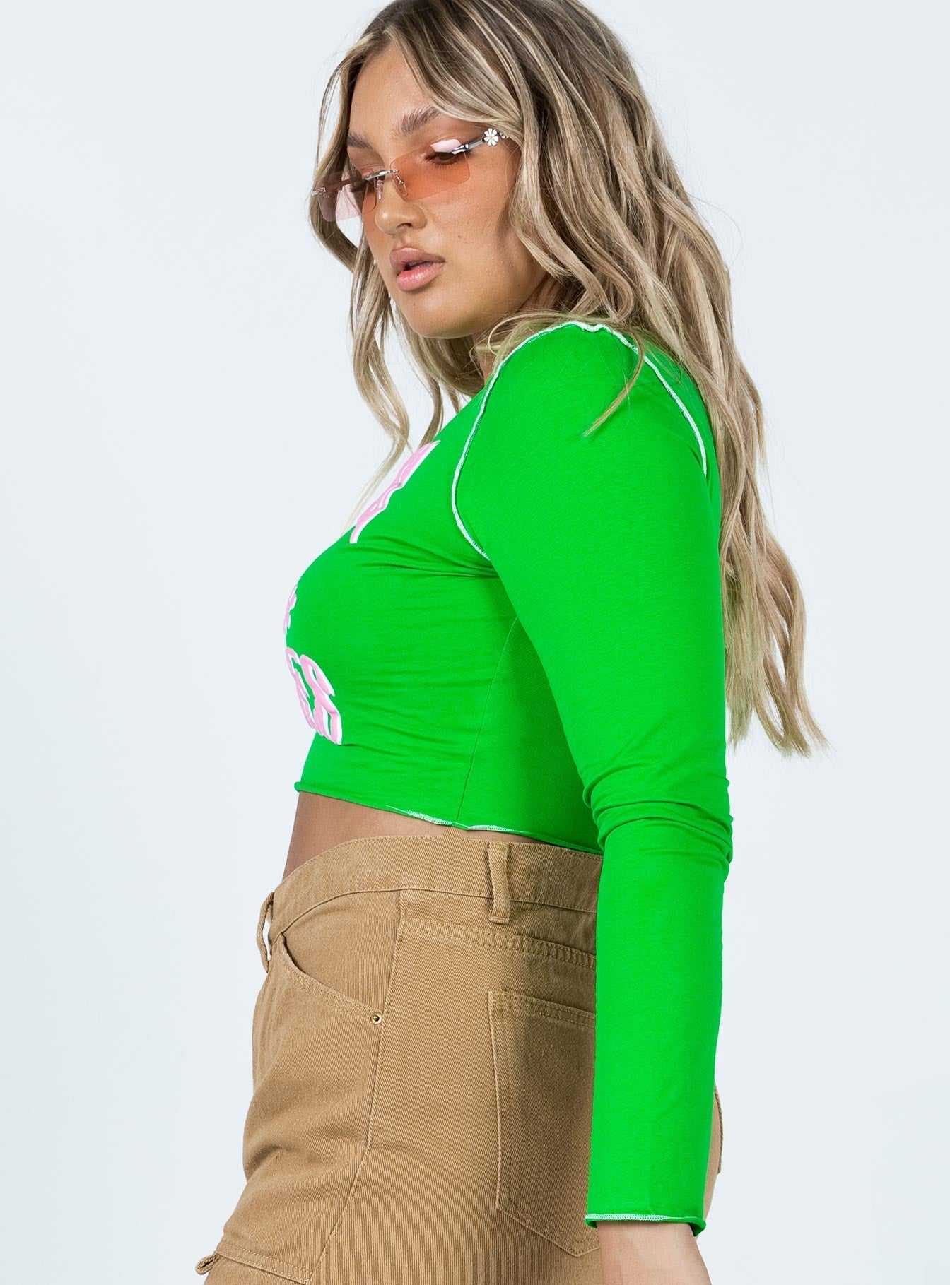 side view of model wearing Princess Polly Good Vibes Long Sleeve Top Green 