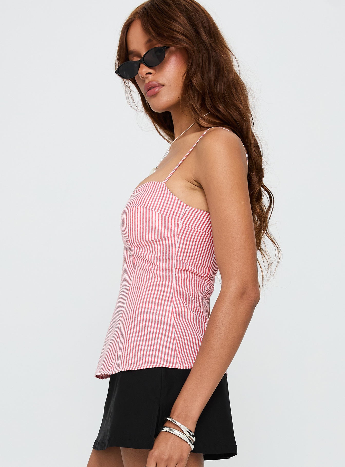 side view of model wearing Princess Polly In Your Palm Top Red Stripe Sleeveless Sweetheart 