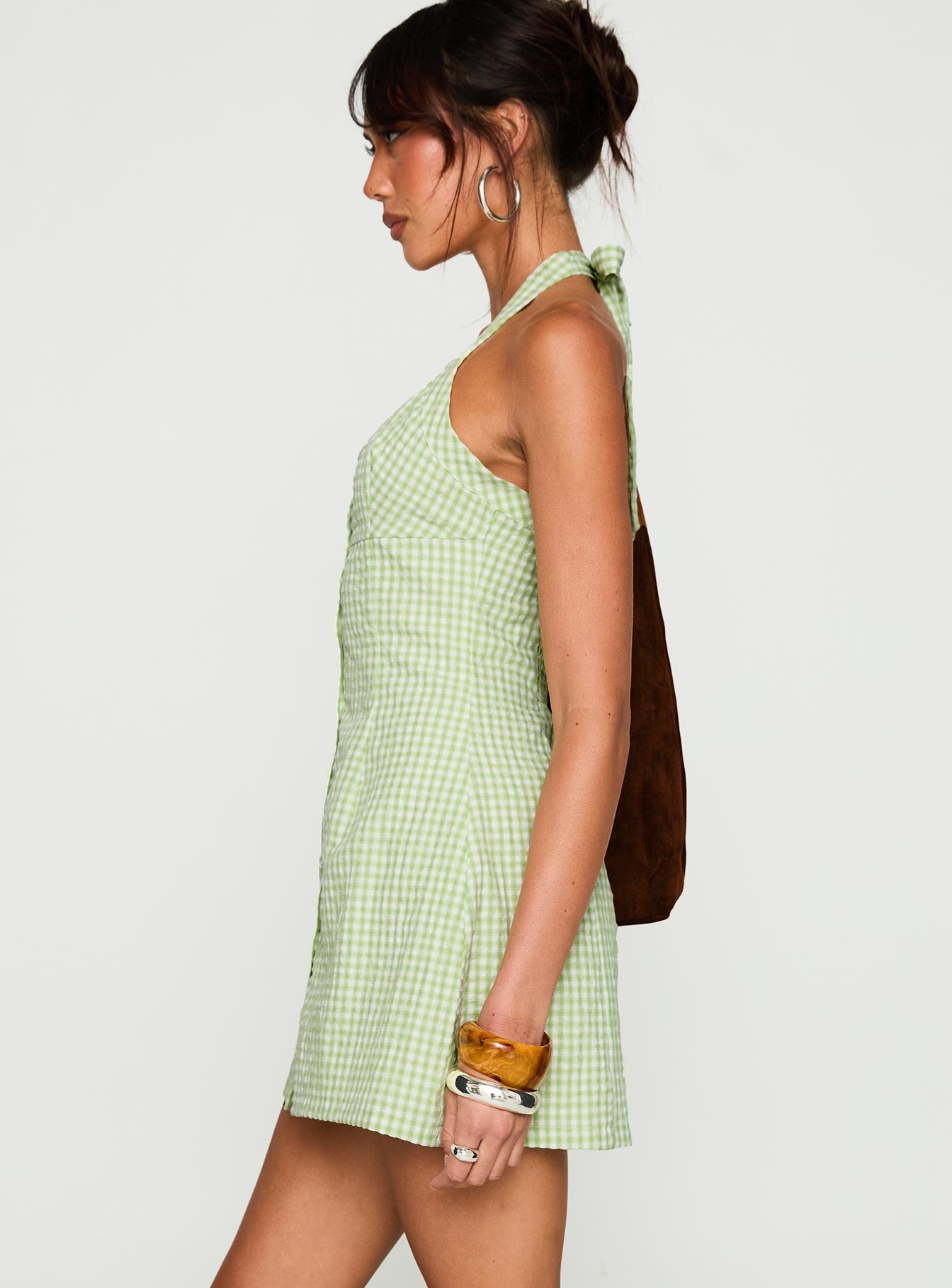 side view of model wearing Princess Polly Mallorie Halter Mini Dress Green Check Scoop Neck 