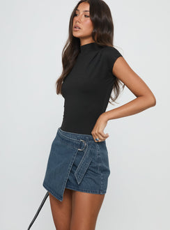   side view of model wearing Princess Polly Elinora Wrap Mini Skirt Mid Blue Wash Mini Skirts 