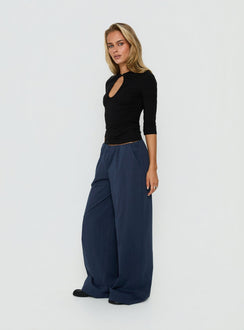 Featuring the Lunea Concealed Waistband Pants Navy in womens-regular-pants with high-rise side view of model wearing Princess Polly