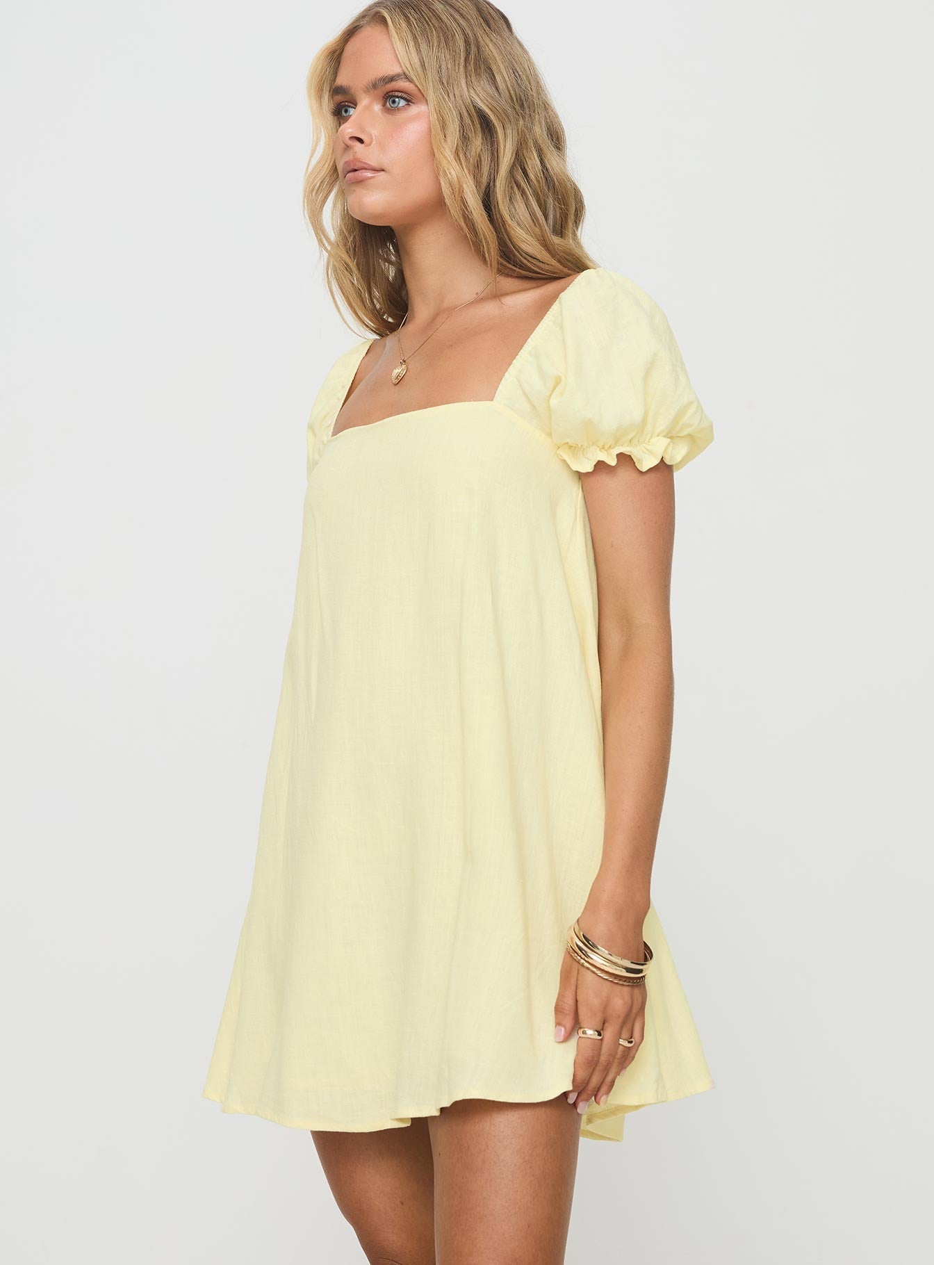 side view of model wearing Princess Polly Beyond Linen Blend Mini Dress Yellow Square Neck 