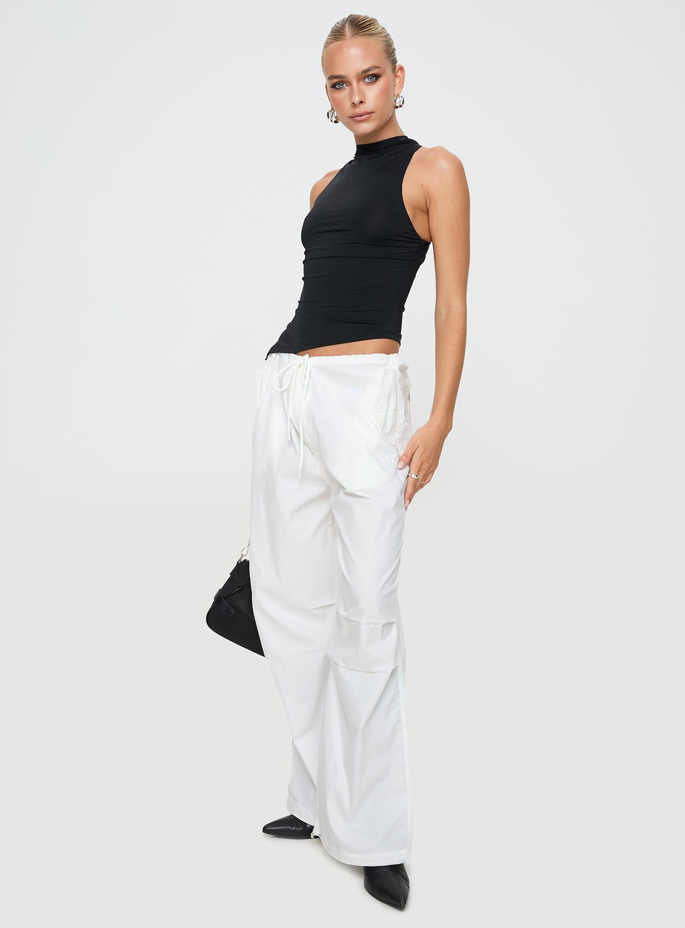 side view of model wearing Princess Polly Blessings Tie Front Cotton Pant White Low Rise Pants 