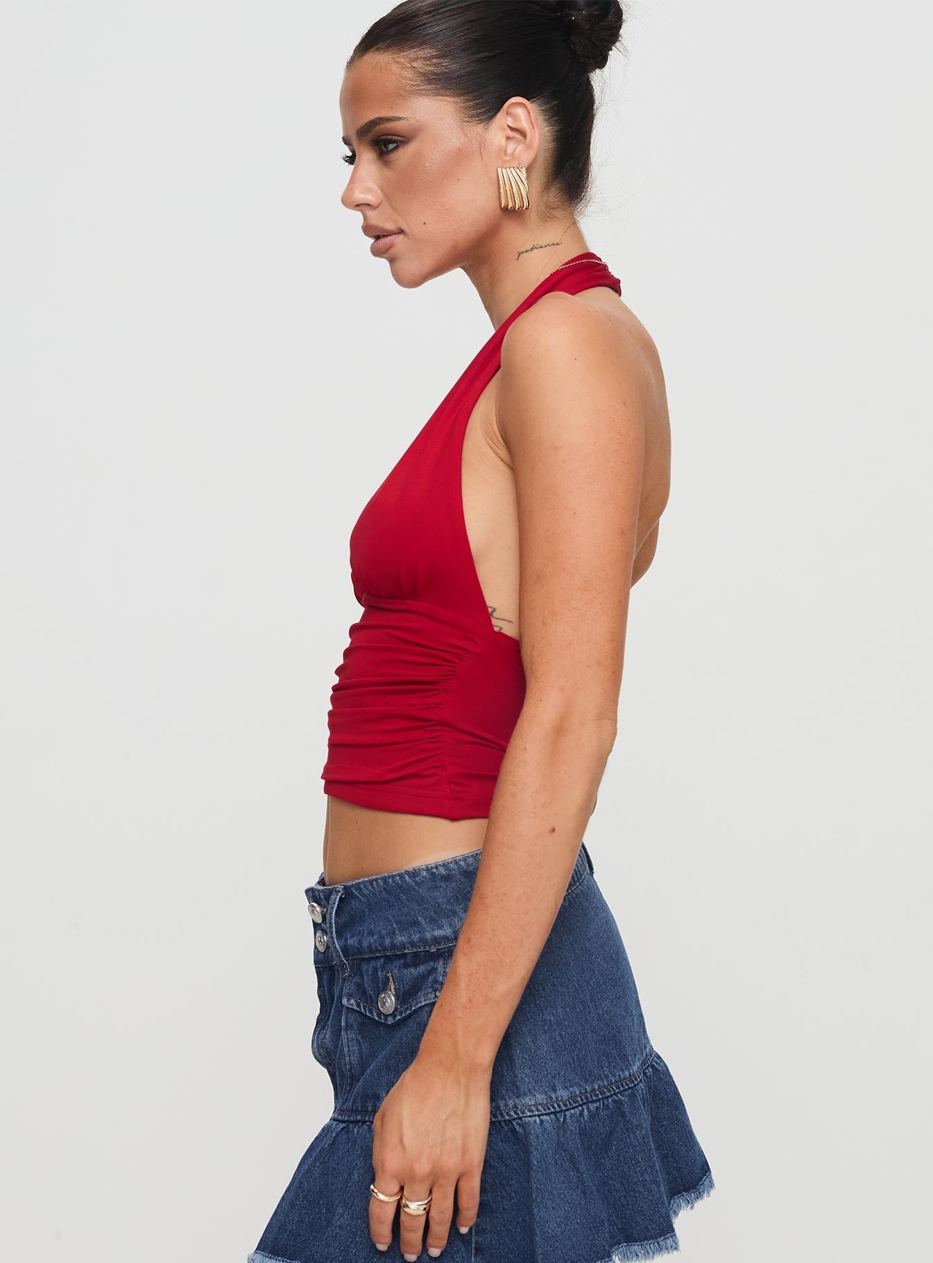 side view of model wearing Princess Polly Love Coast Top Red Sleeveless Plunger 