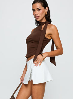 side view of model wearing Princess Polly For The Thrill Skort White High Waisted Shorts 