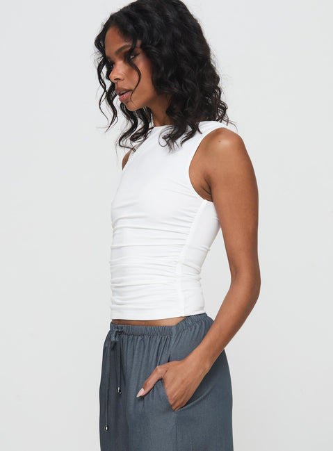 side view of model wearing Princess Polly Solani Top White Sleeveless High Neck 