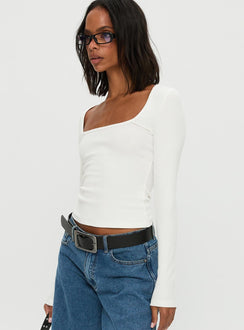 side view of model wearing Princess Polly Baseline Rib Long Sleeve Top White Full Sleeves Scoop Neck 
