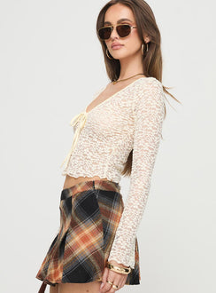 Long sleeve top  Lace material, scoop neckline, tie detail at bust, slightly flared sleeves, sheer design Good stretch, unlined