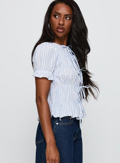 side view of model wearing Princess Polly Alistair Bow Tie Top Blue / White Stripe Short Sleeves Crew Neck 