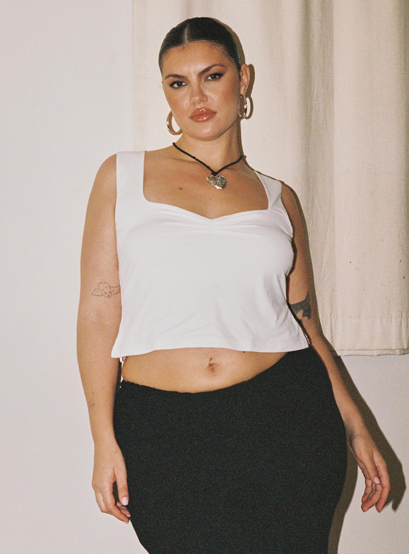 front view of model wearing Princess Polly Rehna Top White Curve Sleeveless Sweetheart 