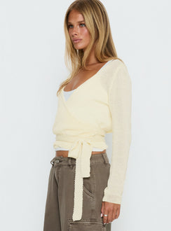 side view of model wearing Princess Polly Tonee Sheer Wrap Knit Cardigan Butter Cream cropped 