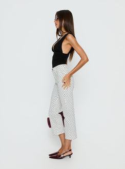side view of model wearing Princess Polly Cindee High Rise Cropped Jeans White Polka Dot High Rise Jeans 