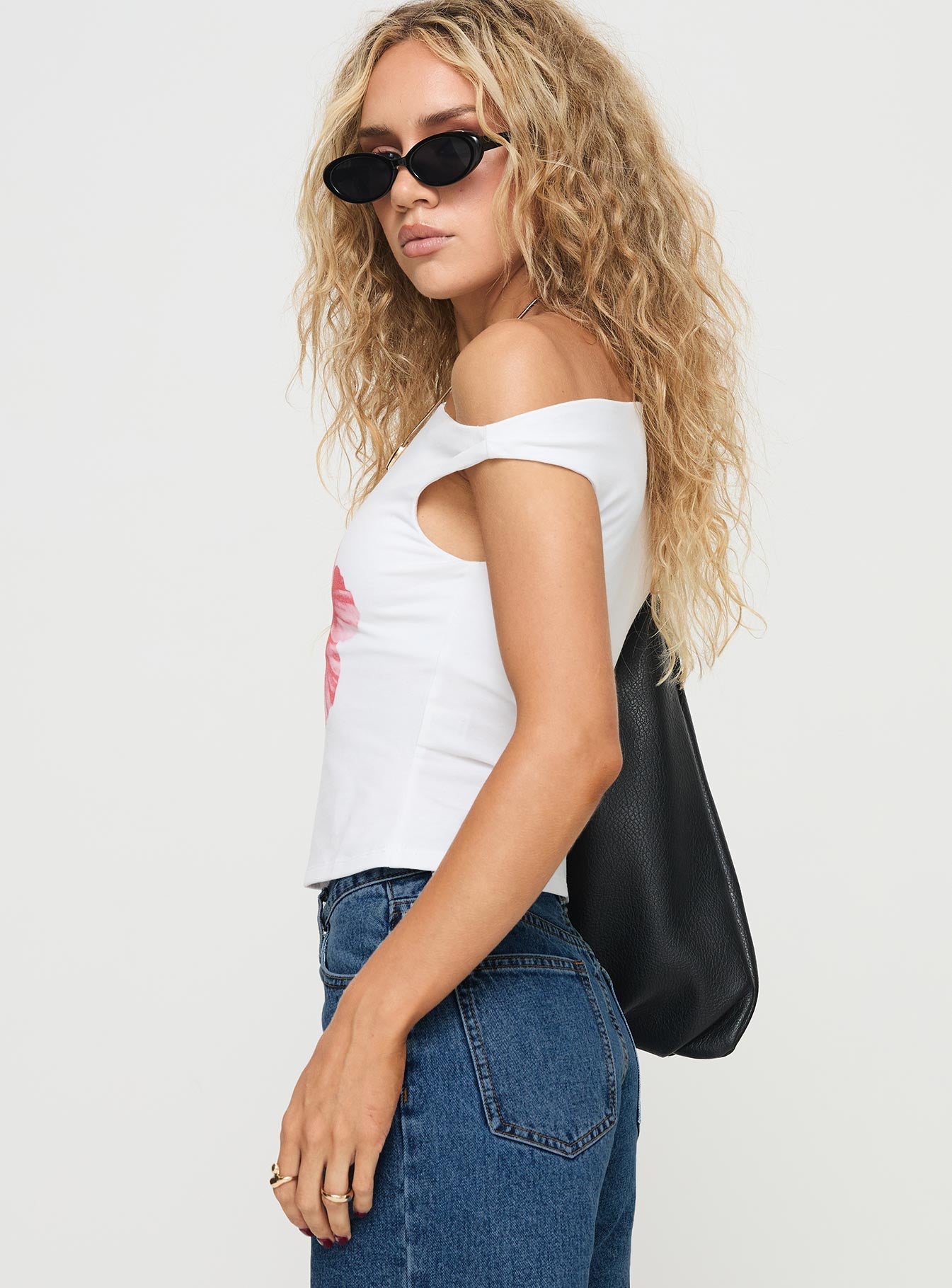 side view of model wearing Princess Polly Edwardi Hibiscus Top White Sleeveless Asymmetric Neckline 