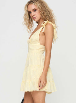side view of model wearing Princess Polly Galvis Mini Dress Lemon Plunger 