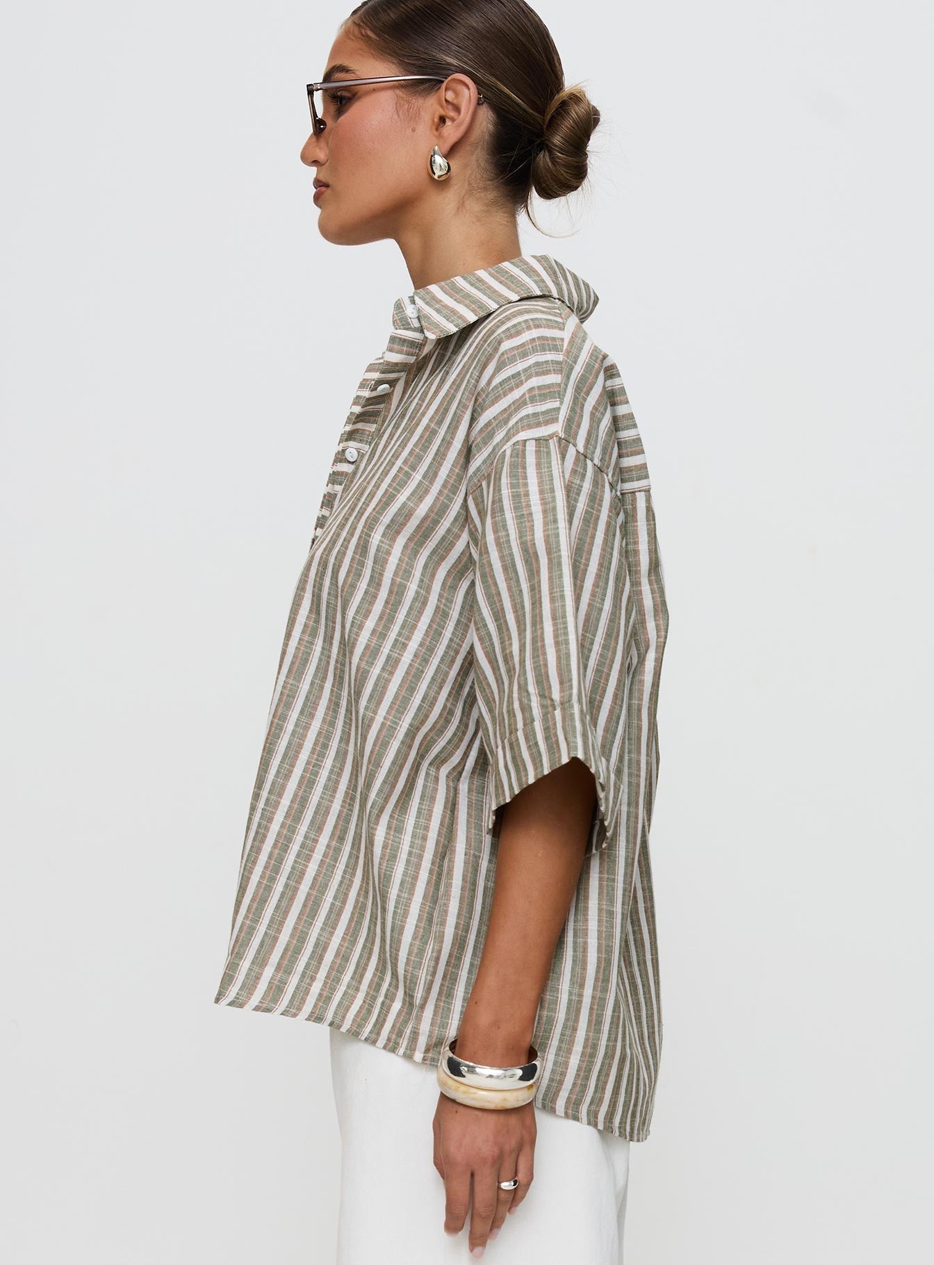 side view of model wearing Princess Polly Qualley Top Multi Half Sleeves V-Neck 