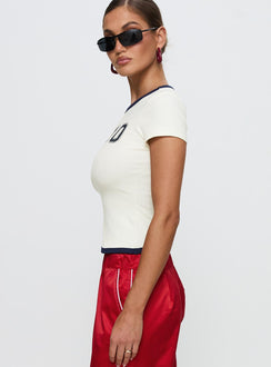 side view of model wearing Princess Polly Track Record Graphic Top Cream Short Sleeves Crew Neck 