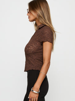 side view of model wearing Princess Polly Best Shot Collared Top Brown Short Sleeves V-Neck 