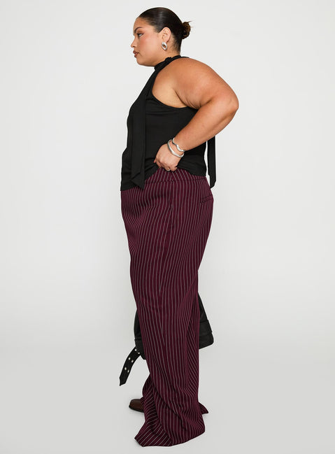 side view of model wearing Princess Polly Lorenne Mid Rise Pant Burgundy Pinstripe Curve 