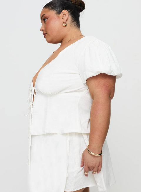 side view of model wearing Princess Polly Wilhelmina Blouse Top White Curve Short Sleeves Plunger 
