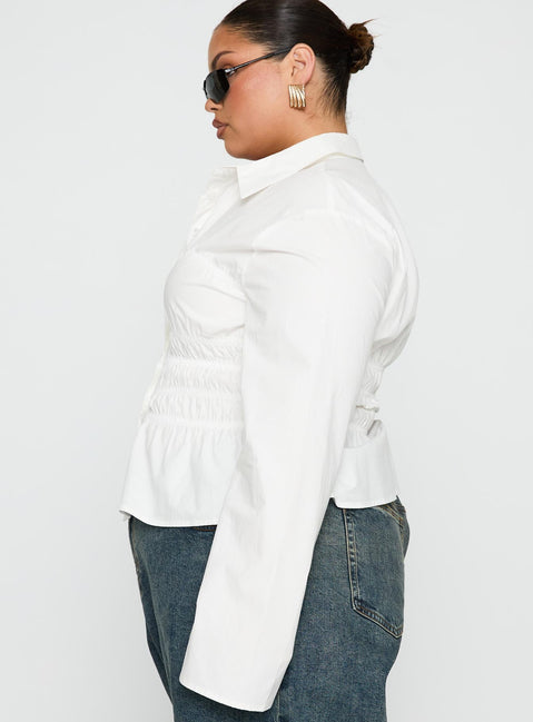 side view of model wearing Princess Polly Liesel Shirred Long Sleeve Top White Curve Full Sleeves V-Neck 