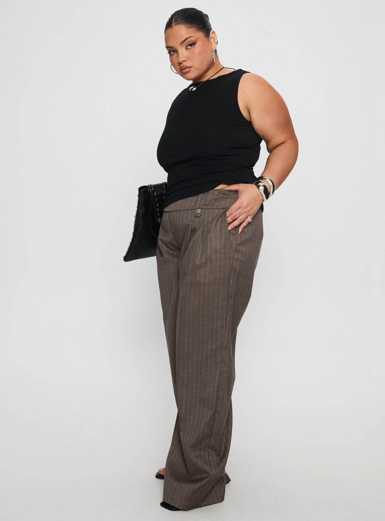 side view of model wearing Princess Polly Briellea Thick Waistband Pant Pinstripe Curve High Rise Pants 