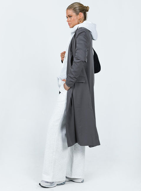 Trench coat Lapel collar Twin hip pockets Split at back