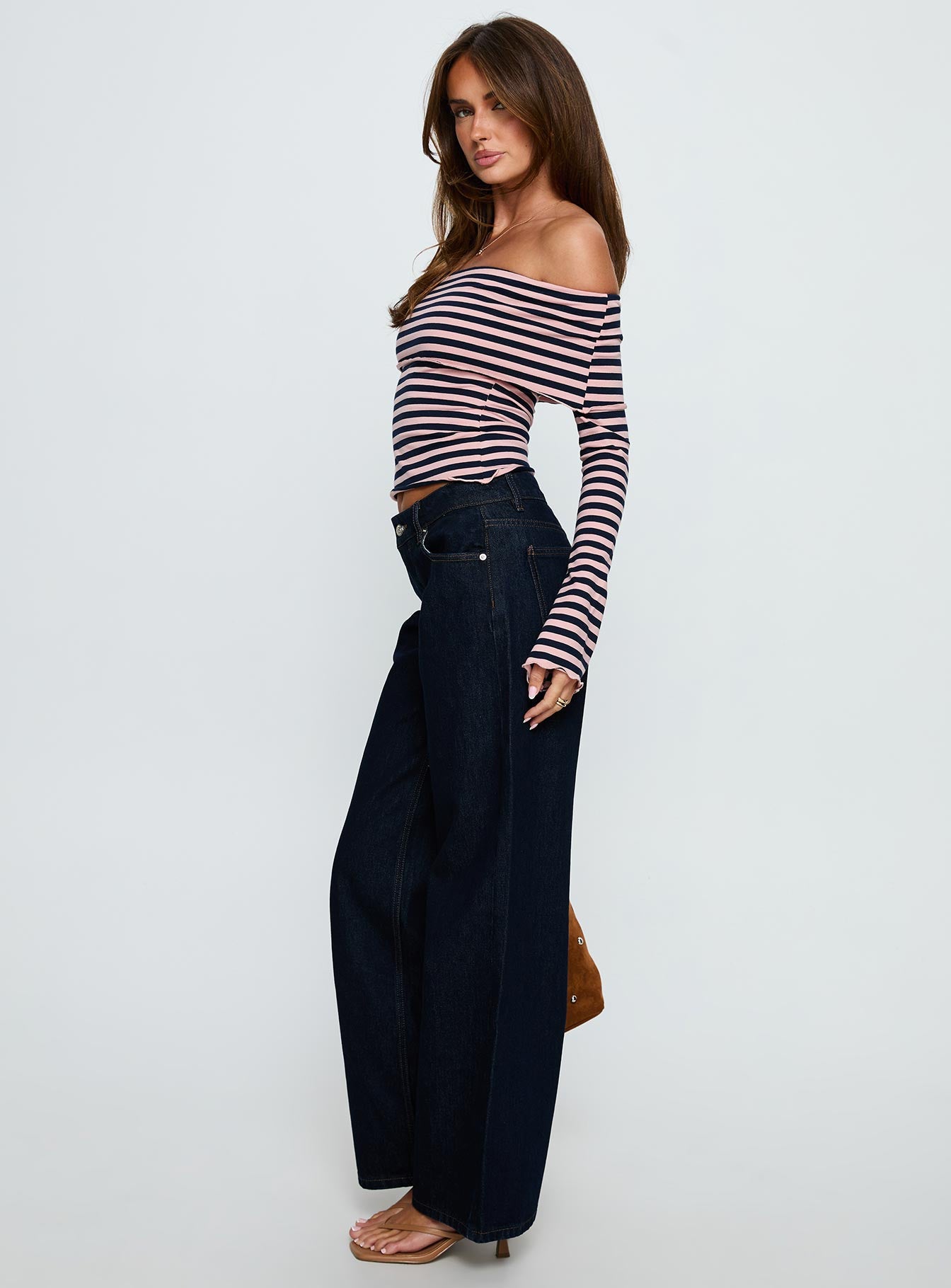 side view of model wearing Princess Polly Ellanor Low Rise Straight Leg Jeans Indigo Blue Low Rise Jeans 