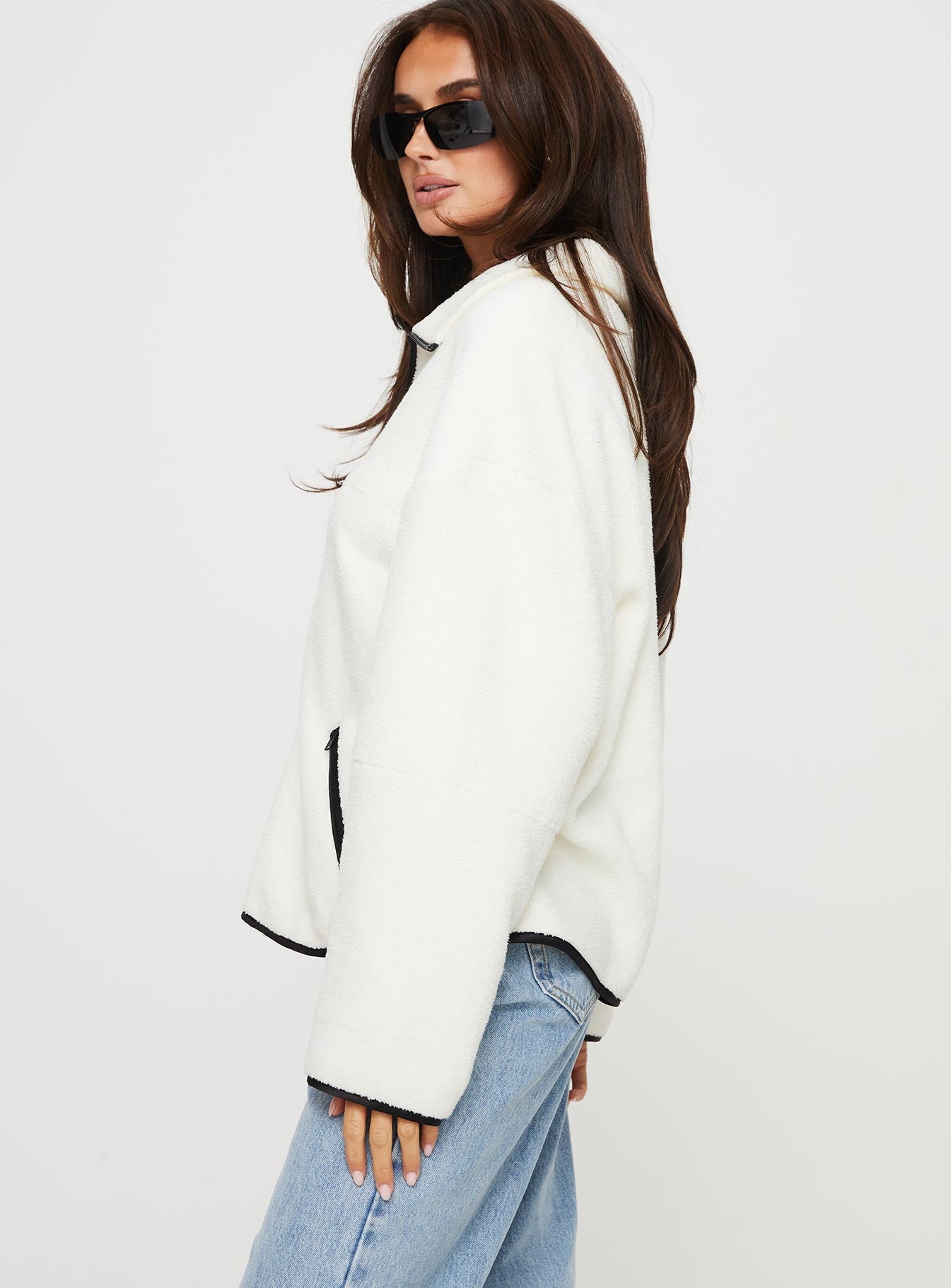 side view of model wearing Princess Polly Samuel Polar Fleece Sweater Cream 