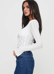 Long sleeve top Scooped neckline, knit material, button fastening at front, tie detail Good stretch, lined bust