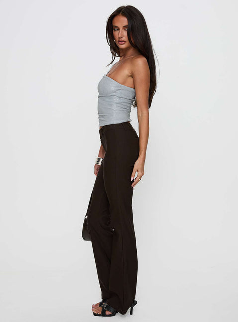 side view of model wearing Princess Polly Kinkirk Flared Pants Chocolate Petite Low Rise Pants 