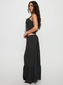   side view of model wearing Princess Polly Modern Girl Maxi Skirt Black / Polka Dot 
