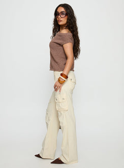 side view of model wearing Princess Polly Remmi Cargo Pants Cream Mid Rise Pants 