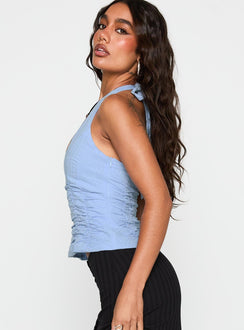 side view of model wearing Princess Polly Nataliya Halter Top Blue Sleeveless Scoop Neck 