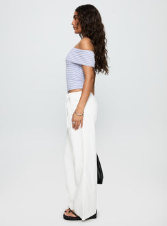 side view of model wearing Princess Polly Leyah Tie Side Pants White Low Rise Pants 
