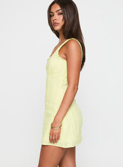 side view of model wearing Princess Polly Dasha Mini Dress Lemon Square Neck 