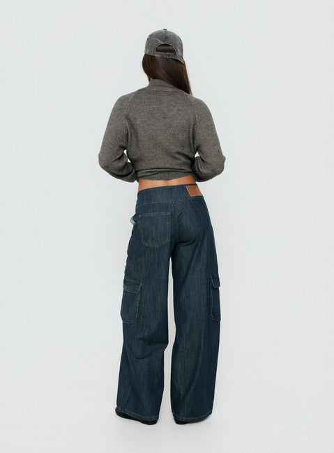 Designed with the Nikoletta Mid Rise Wide Leg Cargo Jeans Dark Blue Wash in womens-jeans with mid-rise back view of model wearing