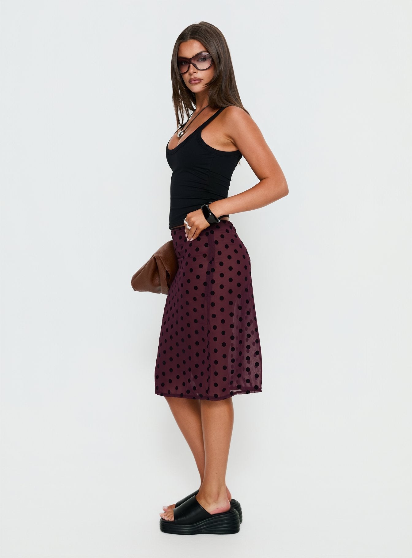   side view of model wearing Princess Polly Evani Sheer Chiffon Midi Skirt Polka Maroon Midi Skirts 